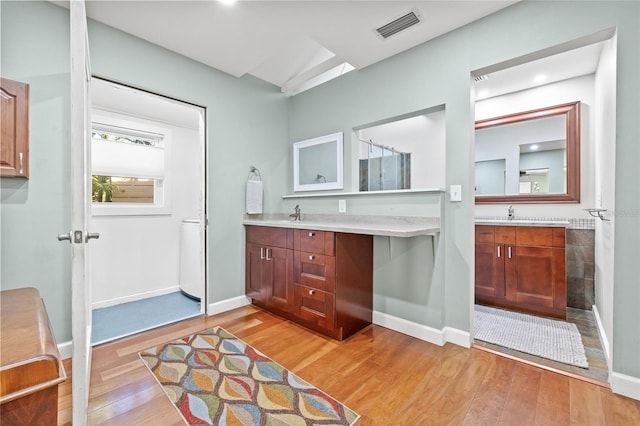 bathroom featuring vanity and hardwood / wood-style flooring