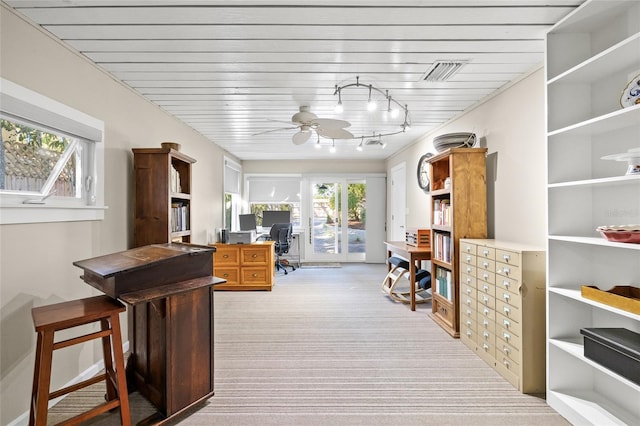 interior space with ceiling fan