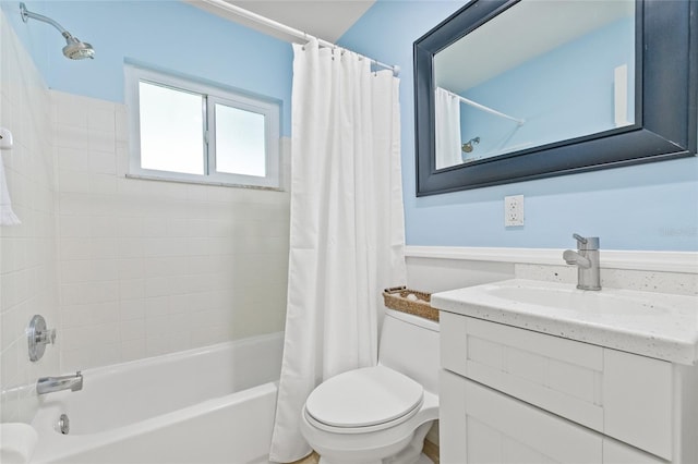 full bathroom featuring shower / bath combo, vanity, and toilet