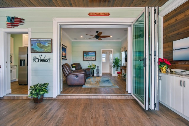 view of exterior entry with ceiling fan