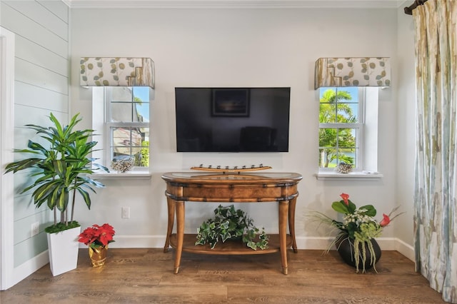 interior space featuring crown molding and hardwood / wood-style flooring