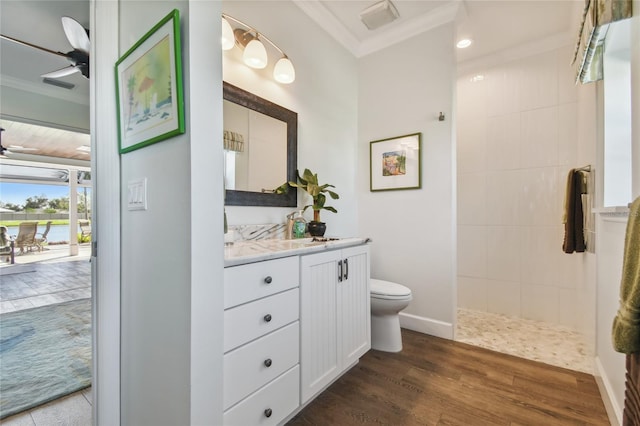 bathroom with vanity, crown molding, ceiling fan, toilet, and wood-type flooring