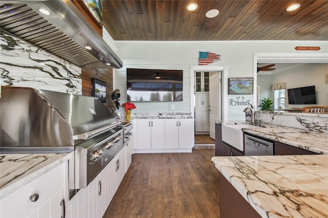 kitchen featuring wooden walls, white cabinets, dark hardwood / wood-style floors, and ventilation hood