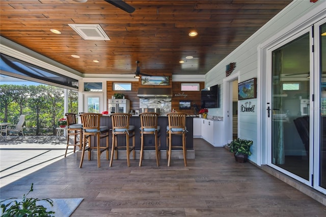 exterior space featuring bar area and wood ceiling