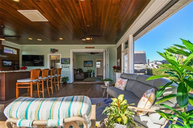 living room featuring dark hardwood / wood-style flooring and wood ceiling