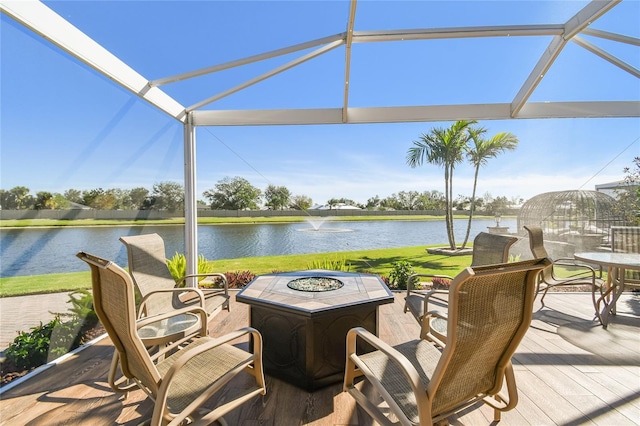 view of patio featuring a water view and an outdoor fire pit