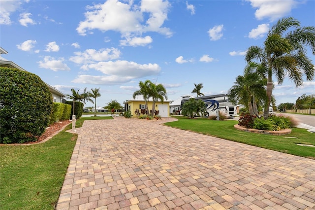 view of home's community featuring a lawn