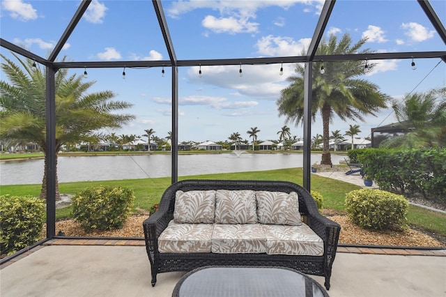 unfurnished sunroom with a water view