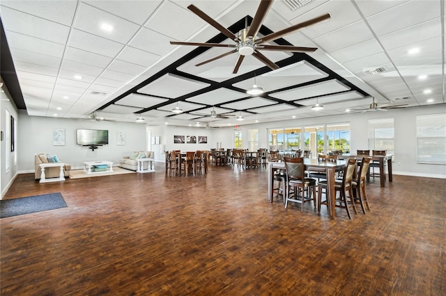 dining area featuring dark hardwood / wood-style flooring and ceiling fan