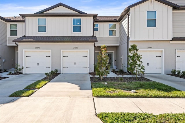 multi unit property featuring a garage