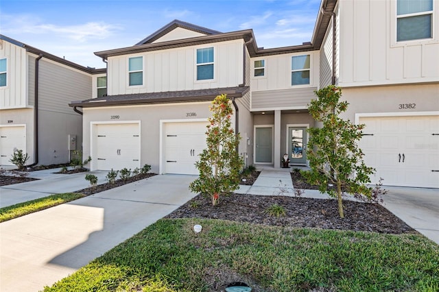 multi unit property featuring a garage