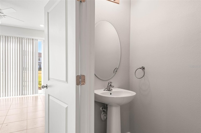 bathroom featuring ceiling fan, tile patterned floors, plenty of natural light, and sink