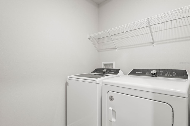 laundry room featuring washing machine and clothes dryer