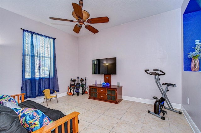 tiled living room featuring ceiling fan