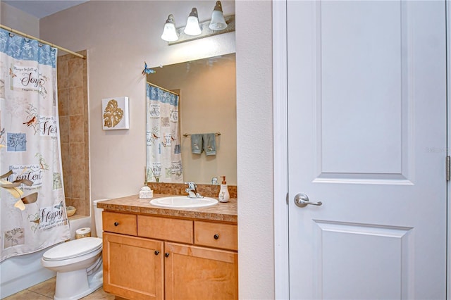 full bathroom with tile patterned floors, shower / bath combo with shower curtain, vanity, and toilet