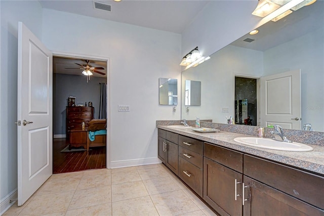 bathroom featuring tile patterned floors, ceiling fan, and vanity