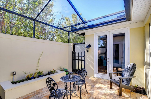 view of patio / terrace featuring a lanai