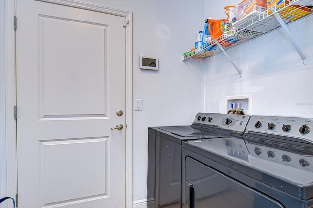 washroom with independent washer and dryer