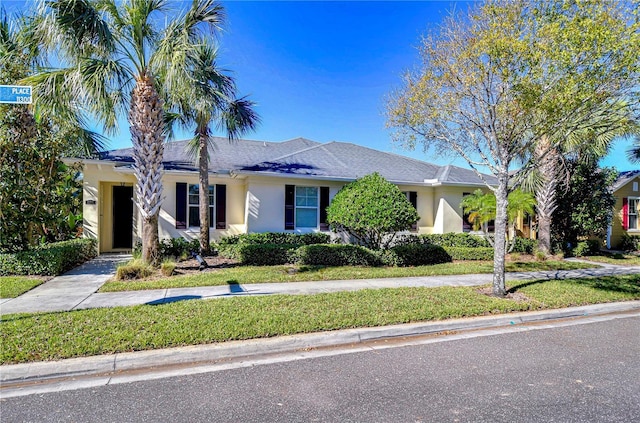 ranch-style house with a front lawn