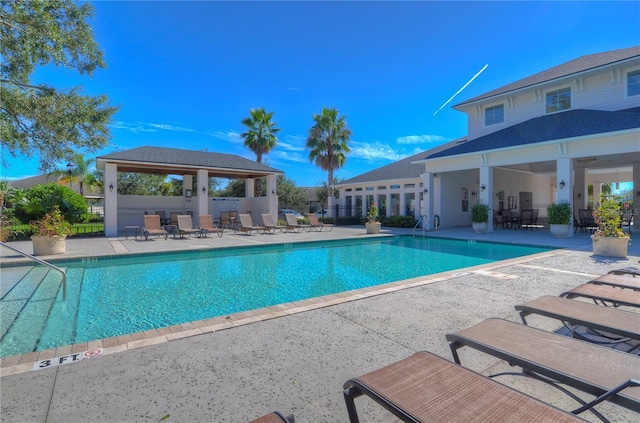 view of swimming pool featuring a gazebo and a patio area