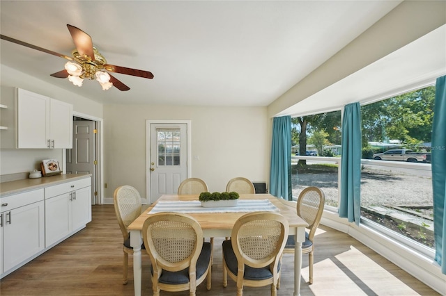 dining room featuring light wood-type flooring and ceiling fan