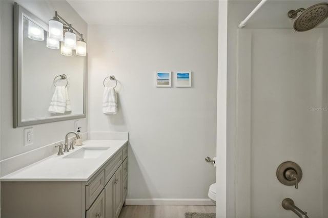 bathroom featuring vanity, toilet, and wood-type flooring