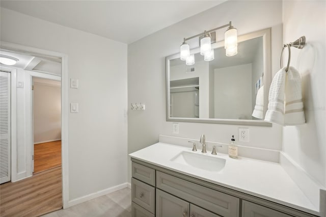 bathroom featuring hardwood / wood-style floors and vanity