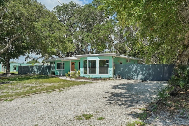 ranch-style house with a front lawn