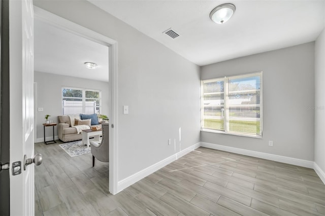 empty room with light hardwood / wood-style flooring