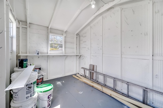 interior space with concrete floors and vaulted ceiling