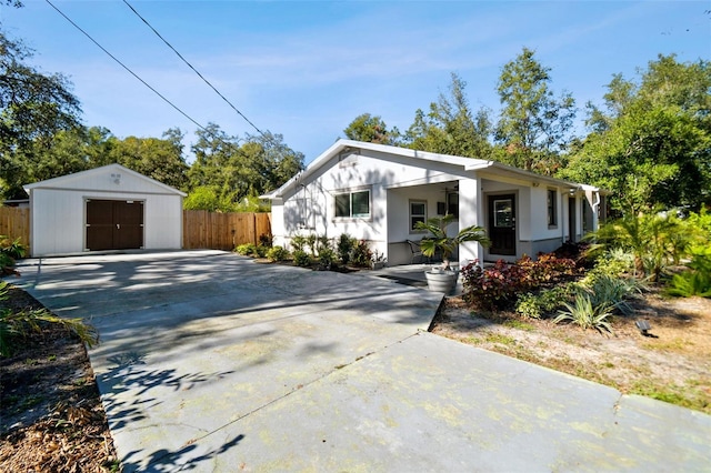 view of front of home featuring a storage shed