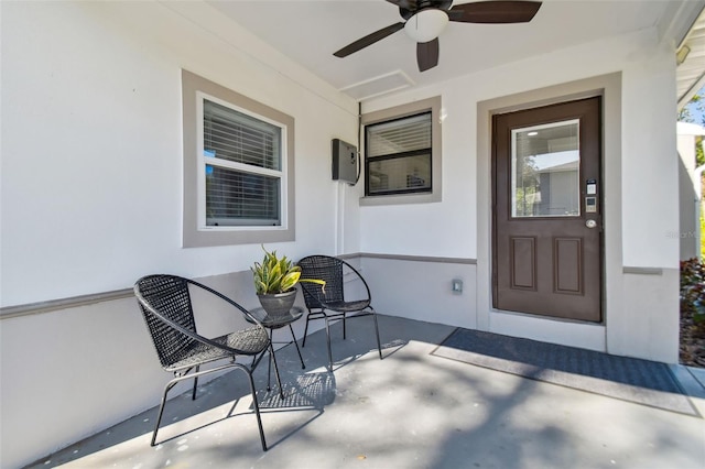 property entrance with ceiling fan