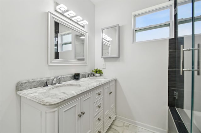 bathroom featuring vanity and a shower with door