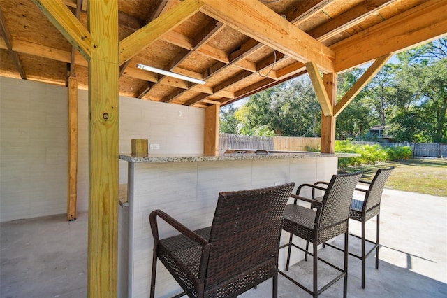 view of patio / terrace featuring an outdoor bar