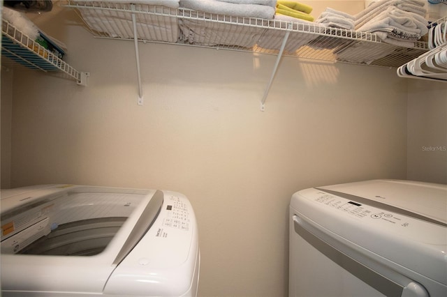 laundry area featuring laundry area and washing machine and dryer