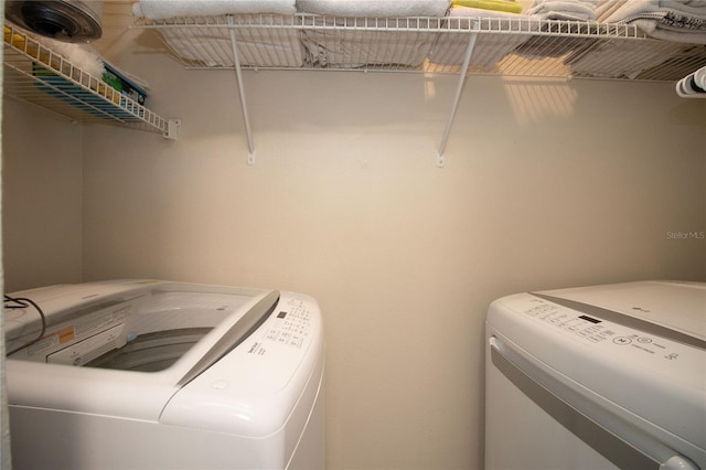 laundry area featuring laundry area and washer and clothes dryer