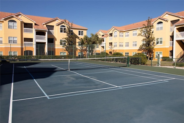 view of sport court with fence