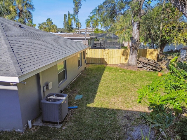 view of yard with central AC