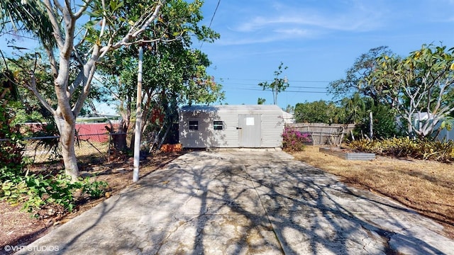 view of patio / terrace featuring an outbuilding