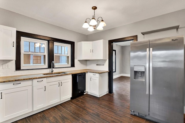 kitchen featuring white cabinetry, stainless steel fridge, sink, and black dishwasher