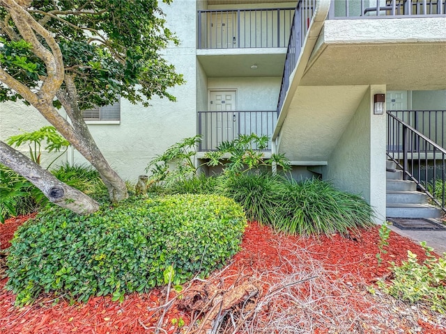 entrance to property featuring a balcony