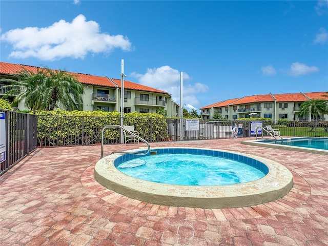 view of pool featuring a community hot tub