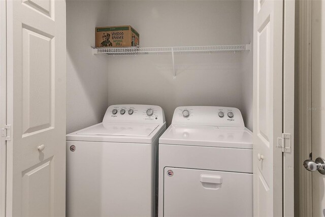 washroom featuring laundry area and independent washer and dryer