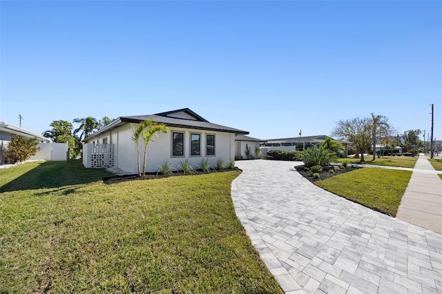 475 Island Way, Clearwater Beach, FL 33767 - view of front of property featuring decorative driveway and stucco siding