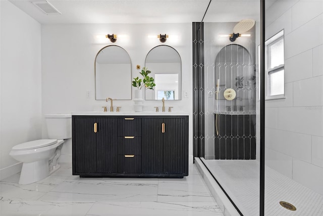 bathroom with vanity, toilet, and a shower