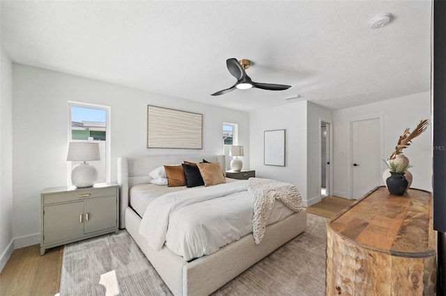 bedroom featuring light hardwood / wood-style floors and ceiling fan