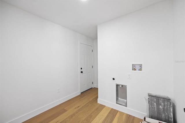 laundry room featuring hookup for an electric dryer, washer hookup, and light hardwood / wood-style flooring