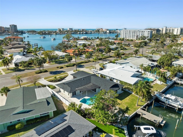 birds eye view of property with a water view