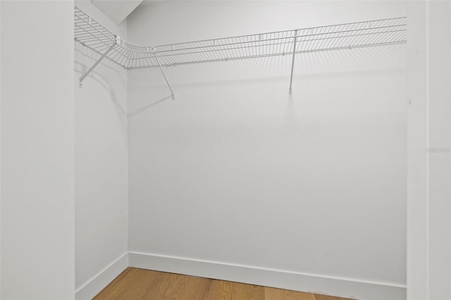 475 Island Way, Clearwater Beach, FL 33767 - spacious closet featuring light wood-type flooring