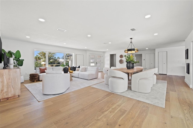 living room with light hardwood / wood-style flooring